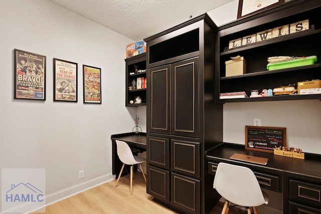 645 Littlefield St, Jesup, GA 31546 - office space featuring built in study area, light wood finished floors, and a textured ceiling