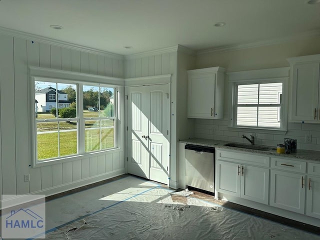 kitchen with dishwasher, decorative backsplash, white cabinetry, and sink