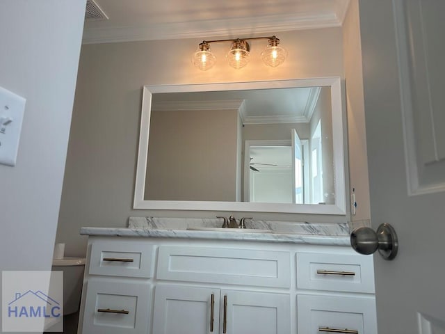 bathroom featuring vanity and crown molding