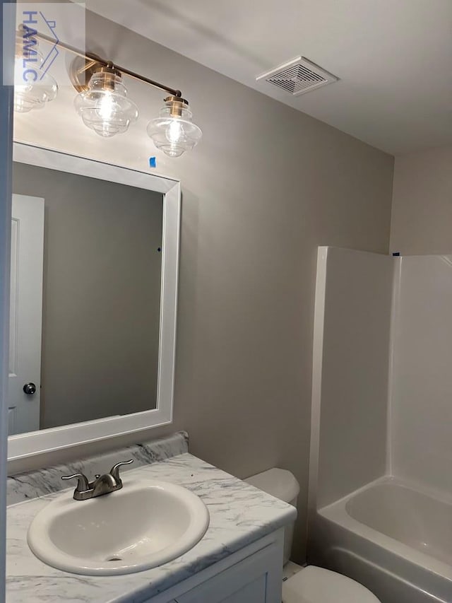 full bathroom with vanity, toilet, and tub / shower combination