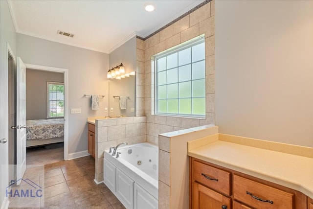 190 Sandpiper Rd, Midway, GA 31320 - ensuite bathroom featuring vanity, ornamental molding, a tub with jets, tile patterned floors, and baseboards