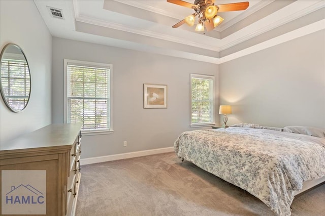 190 Sandpiper Rd, Midway, GA 31320 - bedroom with light colored carpet, ornamental molding, a tray ceiling, baseboards, and ceiling fan