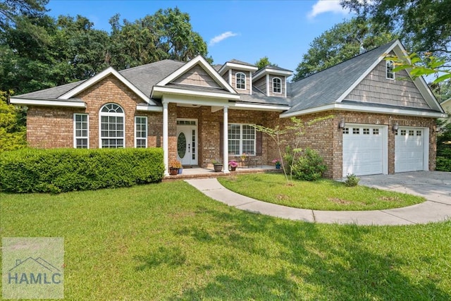 190 Sandpiper Rd, Midway, GA 31320 - view of front of house with a front yard, driveway, a porch, an attached garage, and brick siding