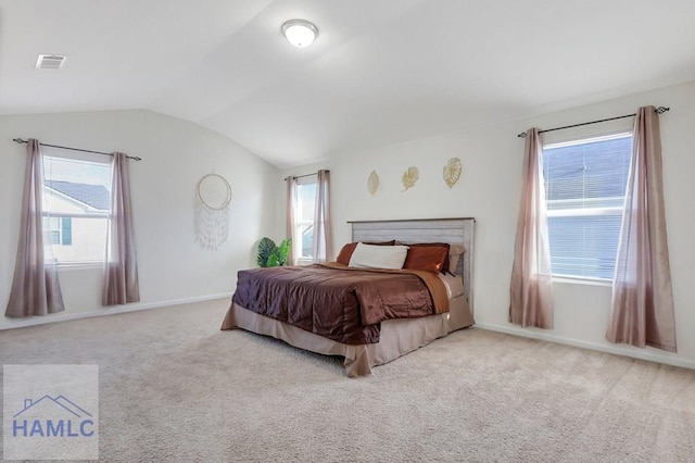 carpeted bedroom featuring vaulted ceiling