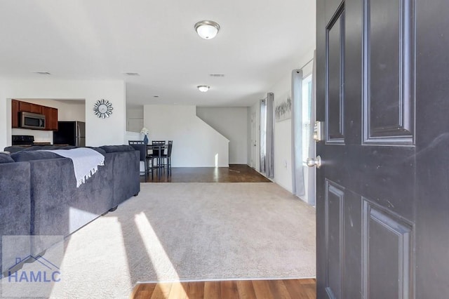 living room featuring dark hardwood / wood-style flooring