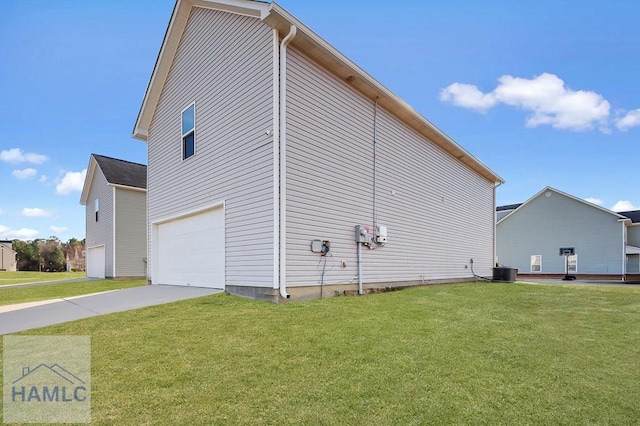 view of home's exterior featuring a garage, a yard, and central air condition unit