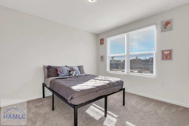 bedroom featuring light carpet