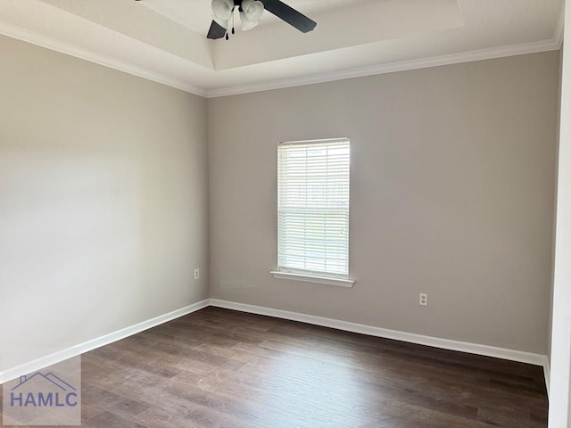 401 Barry Mccaffrey Blvd Unit B4, Hinesville, GA 31313 - spare room featuring a tray ceiling, crown molding, ceiling fan, and dark wood-type flooring