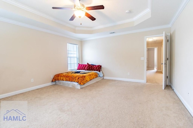 bedroom with a raised ceiling, crown molding, ceiling fan, and light carpet