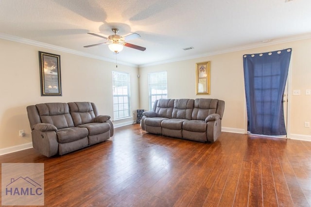 living room featuring ceiling fan, crown molding, and dark wood-type flooring