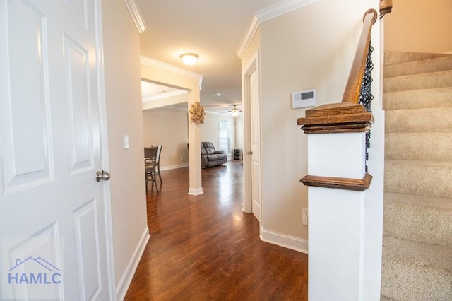 hall with dark hardwood / wood-style floors and ornamental molding