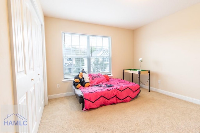 carpeted bedroom featuring a closet