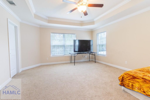 bedroom featuring ceiling fan, ornamental molding, light carpet, and multiple windows