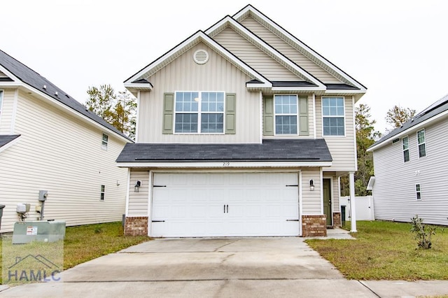 craftsman inspired home with a garage and a front lawn