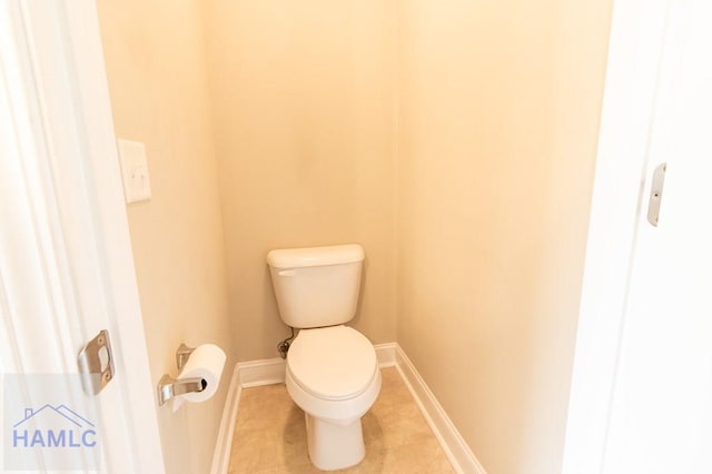 bathroom with tile patterned floors and toilet