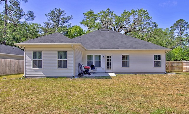 404 Talmadge Rd, Allenhurst, GA 31301 - rear view of property featuring a patio area, a fenced backyard, and roof with shingles