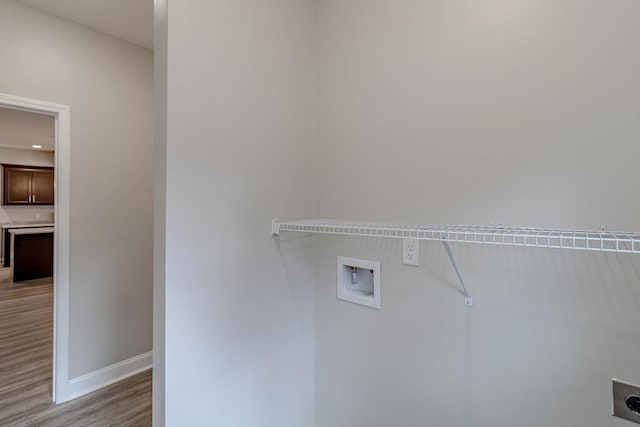 404 Talmadge Rd, Allenhurst, GA 31301 - laundry room with hookup for a washing machine, light wood-style floors, and hookup for an electric dryer