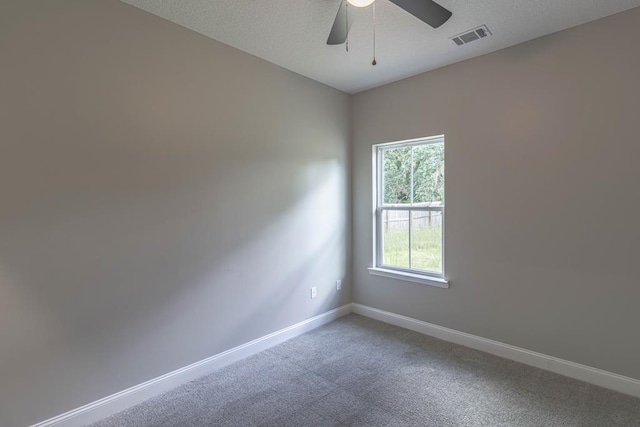 404 Talmadge Rd, Allenhurst, GA 31301 - spare room with light colored carpet, a ceiling fan, and a textured ceiling