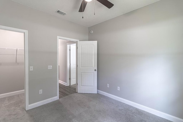 404 Talmadge Rd, Allenhurst, GA 31301 - unfurnished bedroom with a spacious closet, carpet, and ceiling fan