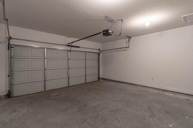 404 Talmadge Rd, Allenhurst, GA 31301 - garage featuring baseboards and a garage door opener