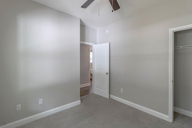 404 Talmadge Rd, Allenhurst, GA 31301 - unfurnished bedroom with carpet flooring, a closet, ceiling fan, and a textured ceiling