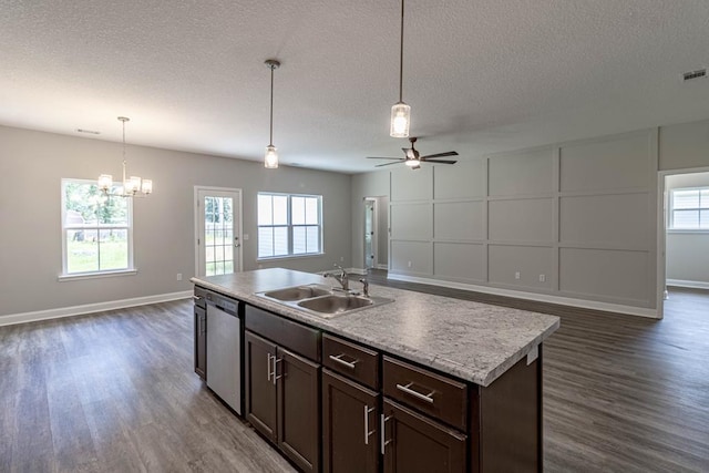 404 Talmadge Rd, Allenhurst, GA 31301 - kitchen featuring open floor plan, dark wood-style floors, ceiling fan, a textured ceiling, and a decorative wall
