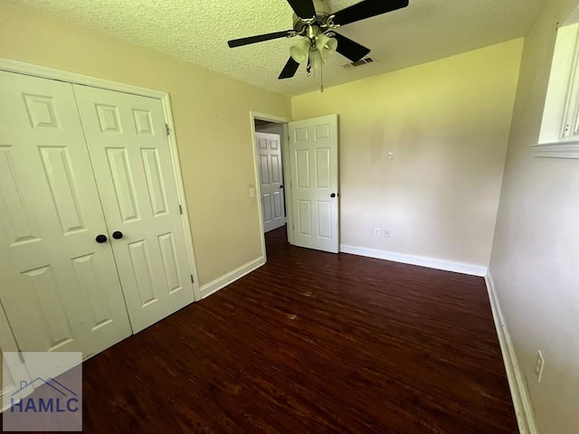 206 Adair St, Jesup, GA 31545 - unfurnished bedroom with wood finished floors, a closet, ceiling fan, and a textured ceiling