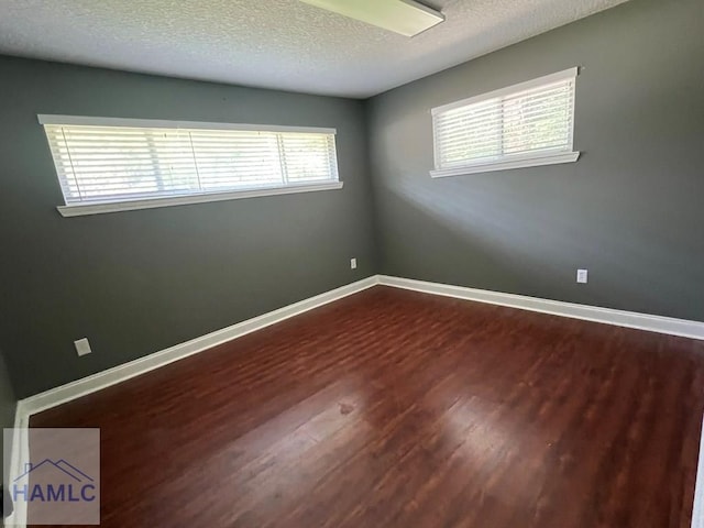 206 Adair St, Jesup, GA 31545 - unfurnished room featuring wood finished floors and a textured ceiling