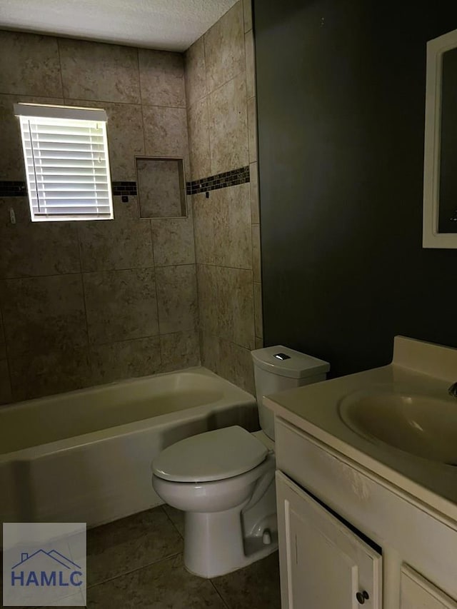 206 Adair St, Jesup, GA 31545 - bathroom featuring tile patterned flooring, vanity, bathing tub / shower combination, and a textured ceiling