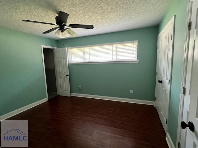 206 Adair St, Jesup, GA 31545 - unfurnished bedroom featuring wood finished floors, a textured ceiling, a closet, and ceiling fan
