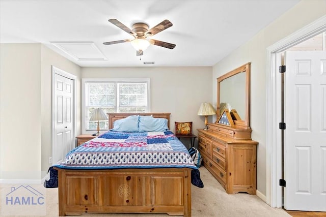 carpeted bedroom with ceiling fan and a closet