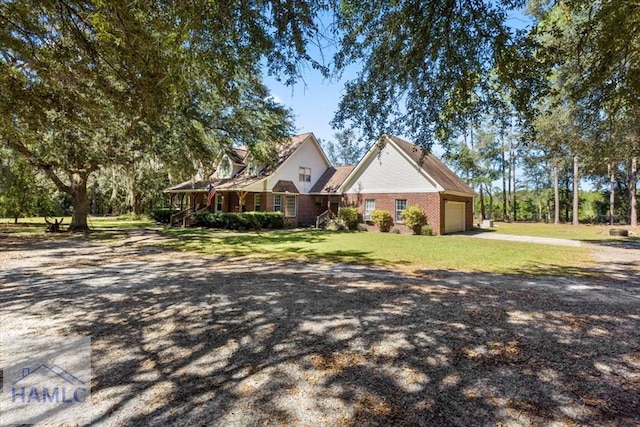 view of front facade with a garage and a front yard