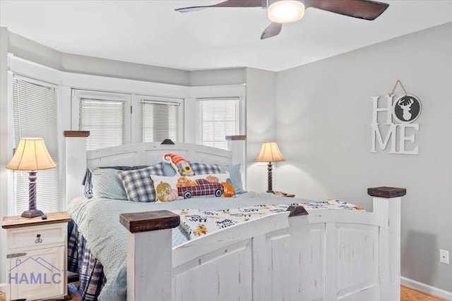 bedroom with ceiling fan and light wood-type flooring