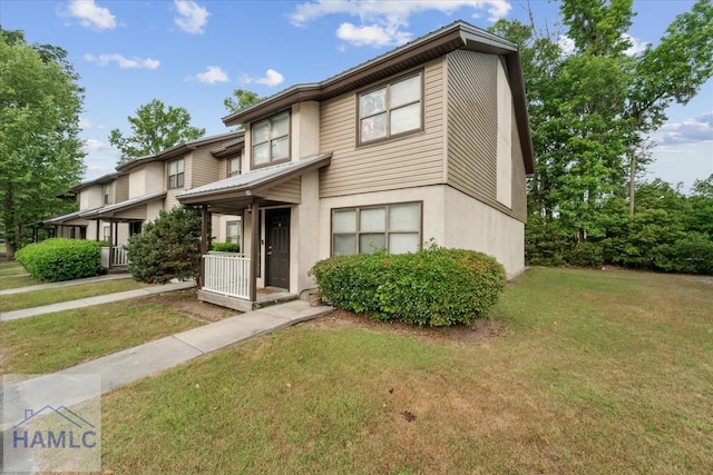 601 Tupelo Trl Unit 39I, Hinesville, GA 31313 - townhome / multi-family property with stucco siding and a front lawn