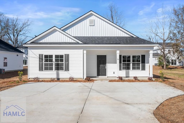 rear view of property featuring central AC unit