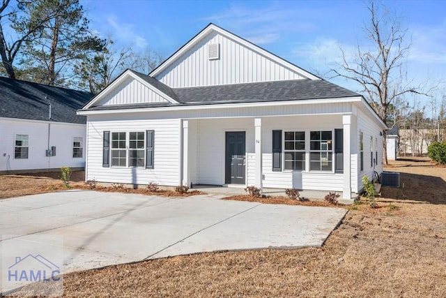 view of front of home with covered porch and central air condition unit