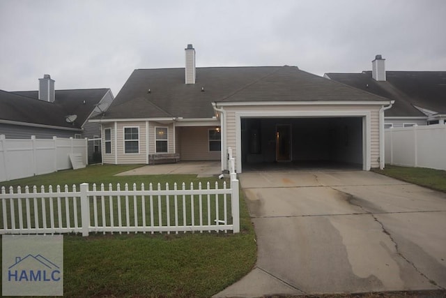 exterior space with a front yard and a garage