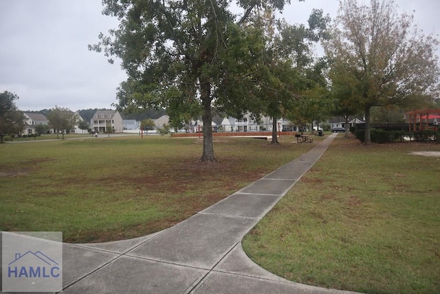 view of community featuring a lawn