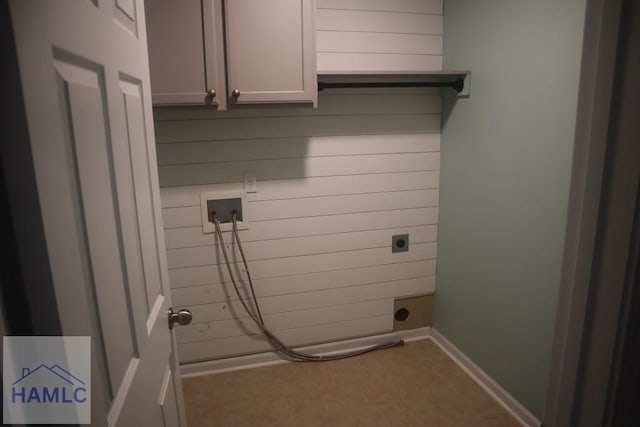 washroom featuring cabinets, washer hookup, and electric dryer hookup