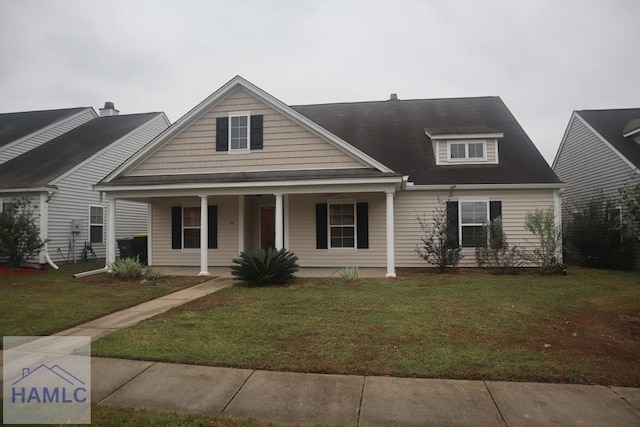 view of front of house featuring a front yard and a porch