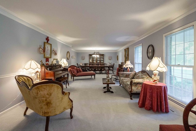 carpeted living room with ornamental molding and a notable chandelier