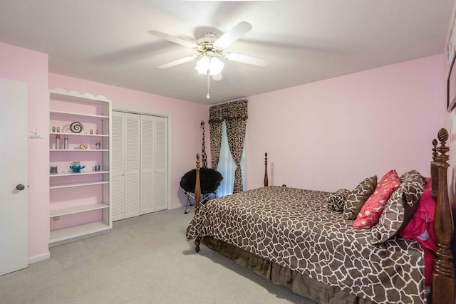 carpeted bedroom with a closet and ceiling fan