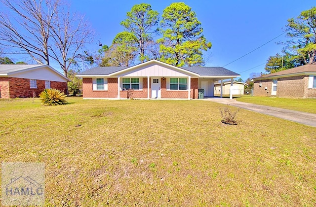 ranch-style home with a front lawn, an attached carport, concrete driveway, and brick siding