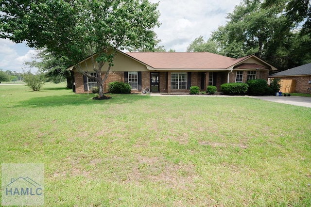 581 Joseph Martin Rd, Hinesville, GA 31313 - single story home featuring a front lawn and brick siding
