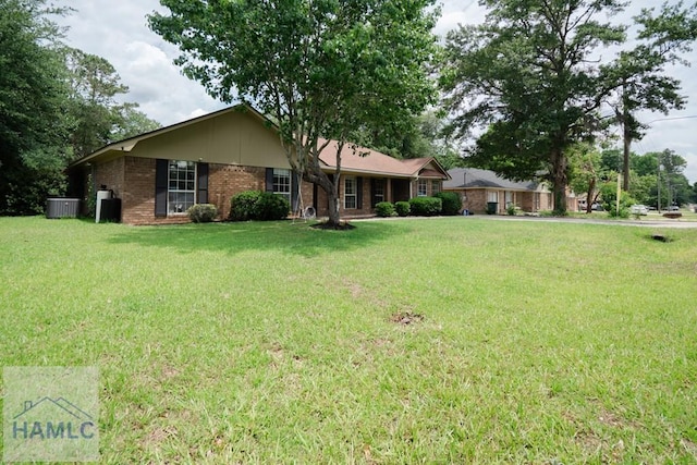 581 Joseph Martin Rd, Hinesville, GA 31313 - view of front of property with brick siding and a front lawn