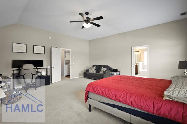 246 Cumberland Dr NE, Ludowici, GA 31316 - bedroom featuring vaulted ceiling, carpet flooring, and a ceiling fan