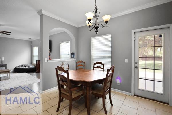 246 Cumberland Dr NE, Ludowici, GA 31316 - dining room with light tile patterned flooring, a chandelier, ornamental molding, and a ceiling fan
