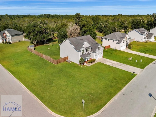 246 Cumberland Dr NE, Ludowici, GA 31316 - aerial perspective of suburban area featuring a heavily wooded area