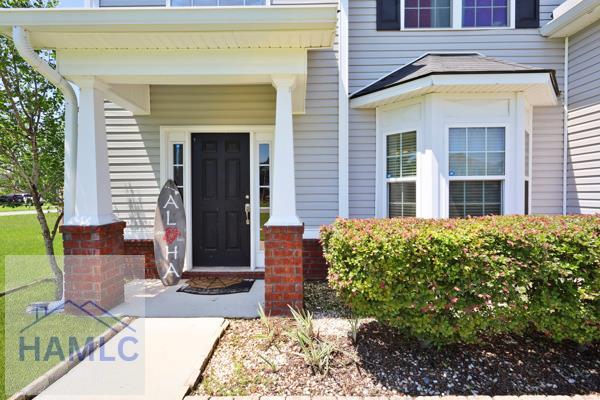 246 Cumberland Dr NE, Ludowici, GA 31316 - view of exterior entry with covered porch