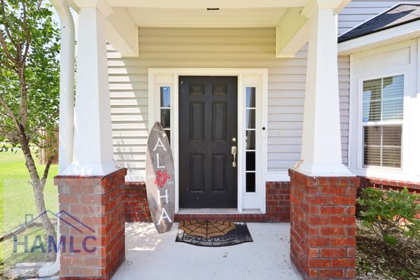246 Cumberland Dr NE, Ludowici, GA 31316 - entrance to property featuring covered porch